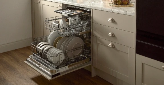 Hisense dishwasher in kitchen open and full of dishes Hisense dishwasher in kitchen open and full of dishes