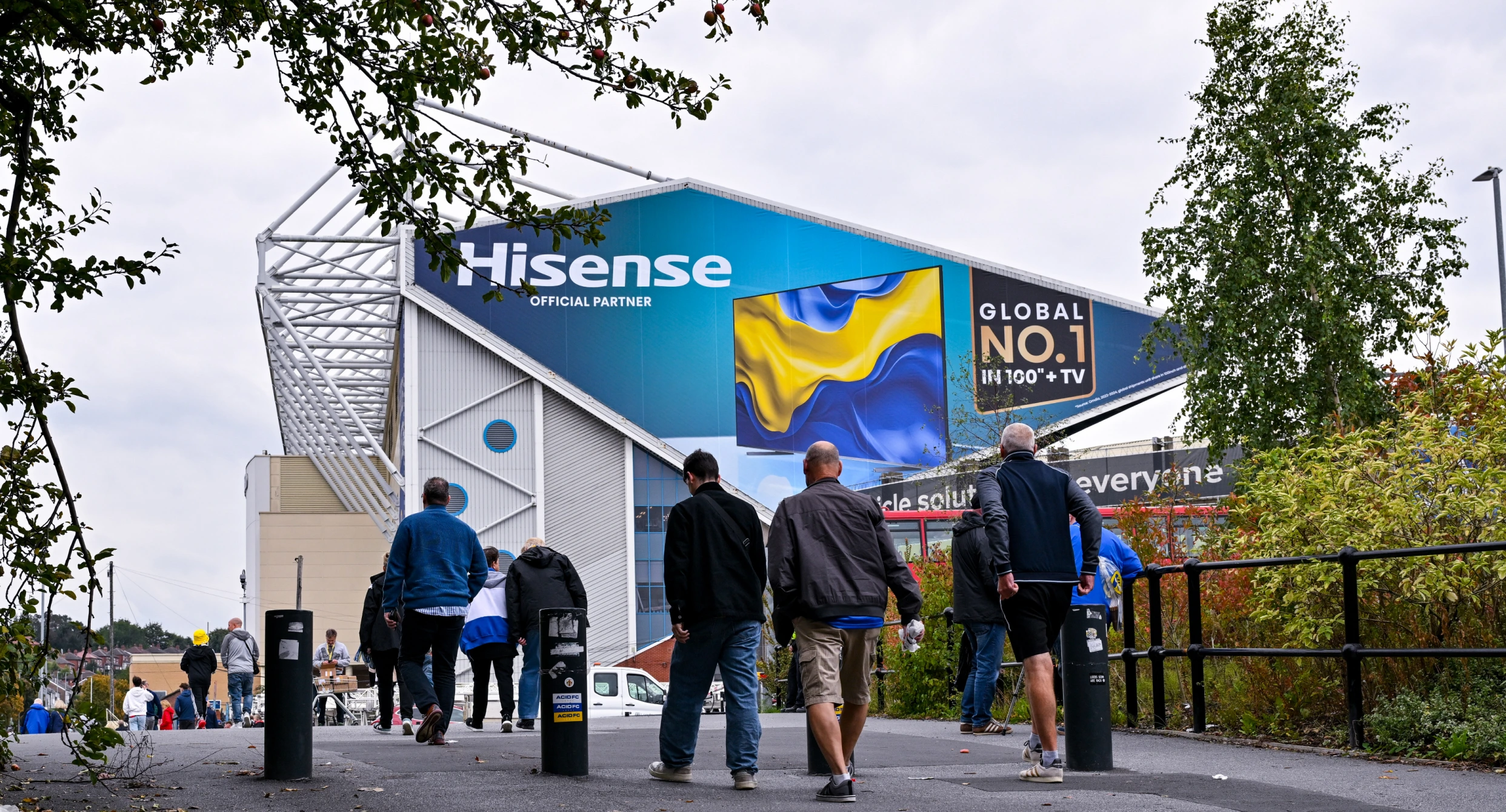 Image showing fans walking towards Elland Road with Hisense branding Image showing fans walking towards Elland Road with Hisense branding