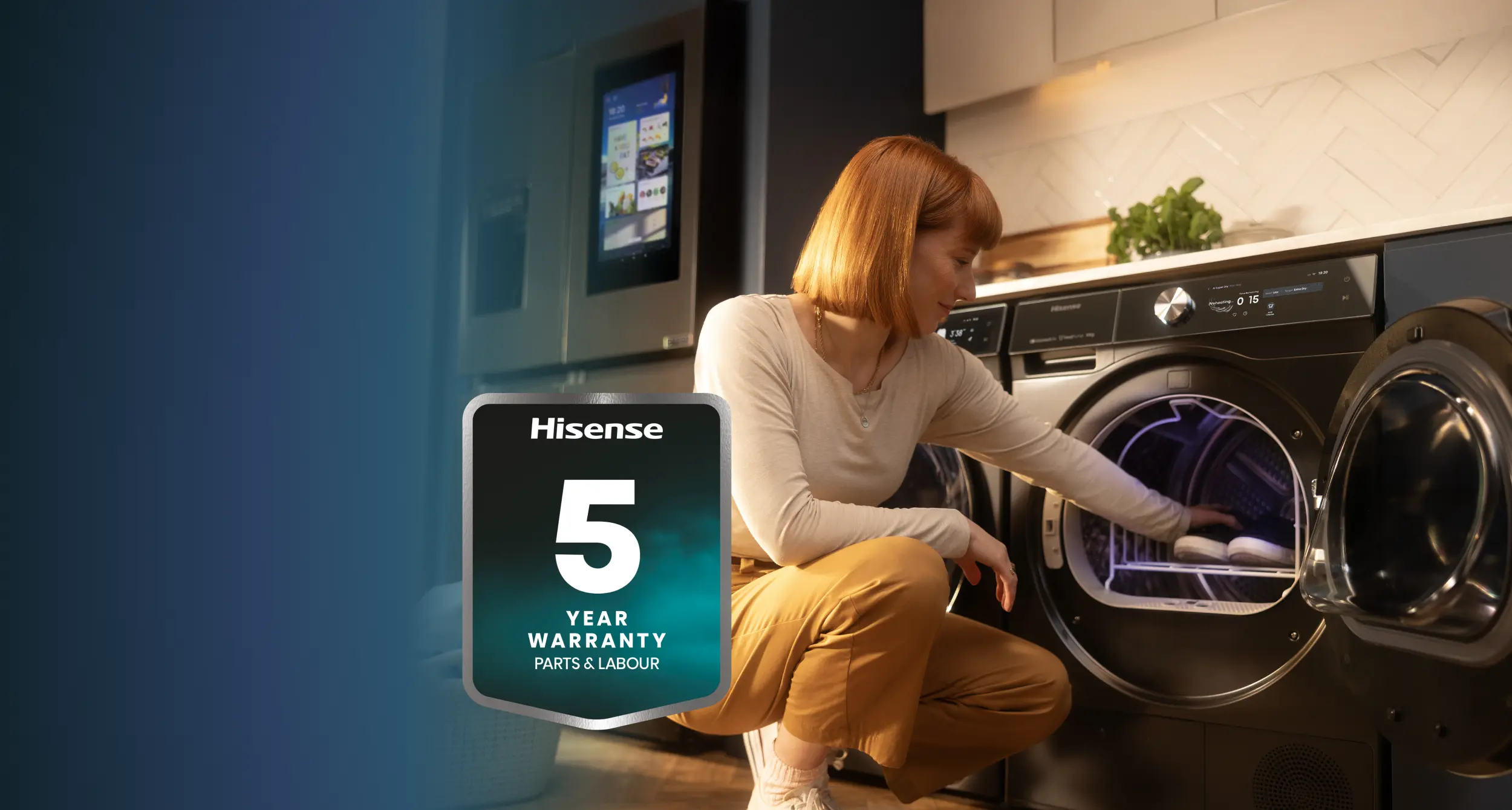 Lady emptying washing machine in kitchen Lady emptying washing machine in kitchen
